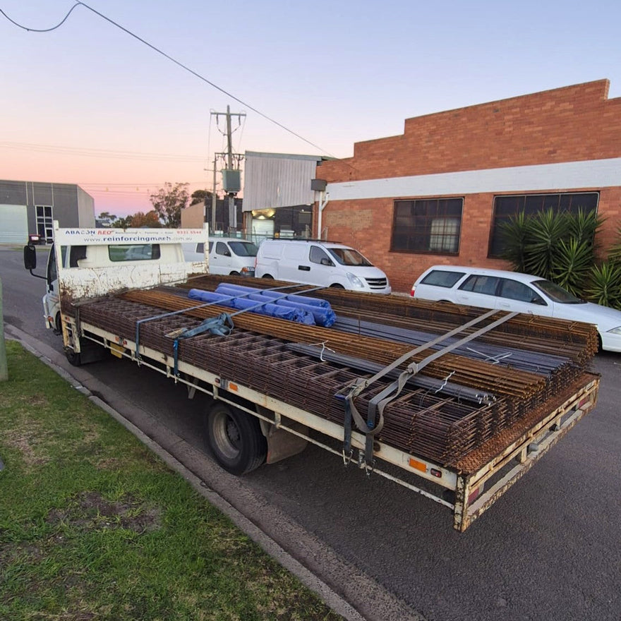 A Chain.com.au delivery truck fully loaded with reinforcing mesh, trench mesh, reinforcing bar, polyfoam and concrete accessories, ready for delivery to Eltham.