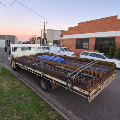 A Chain.com.au delivery truck fully loaded with reinforcing mesh, trench mesh, reinforcing bar, polyfoam and concrete accessories, ready for delivery to Eltham.